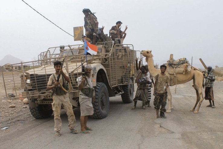 UAE-backed Yemeni forces are seen at Al-Anad Air Base in southern Yemen on 4 August 2015, soon after it was captured from Houthi rebels. The flag on the Oshkosh M-ATV is that of the defunct People’s Democratic Republic of Yemen, indicating the fighters are southern separatists who are not loyal to the internationally recognised government.