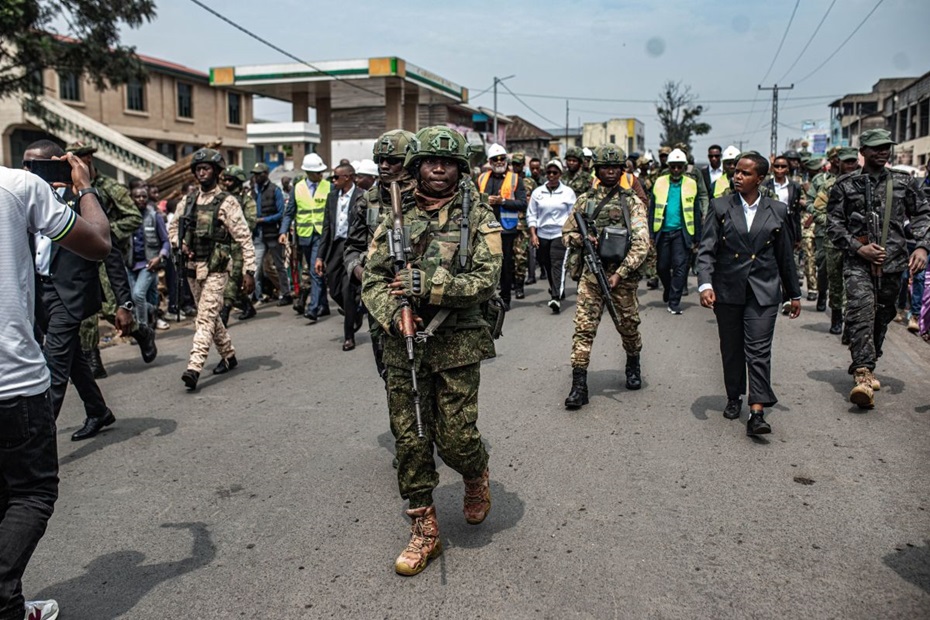 Photograph of Soldiers walking down the street as M23 North Kivu provincial leadership marked one year of M23's control of Goma