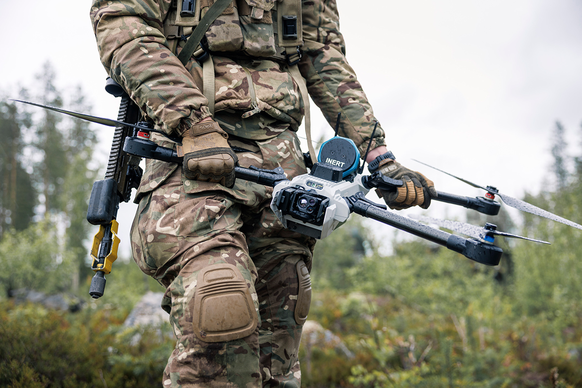 A British soldier holding a one-way effector UAV named