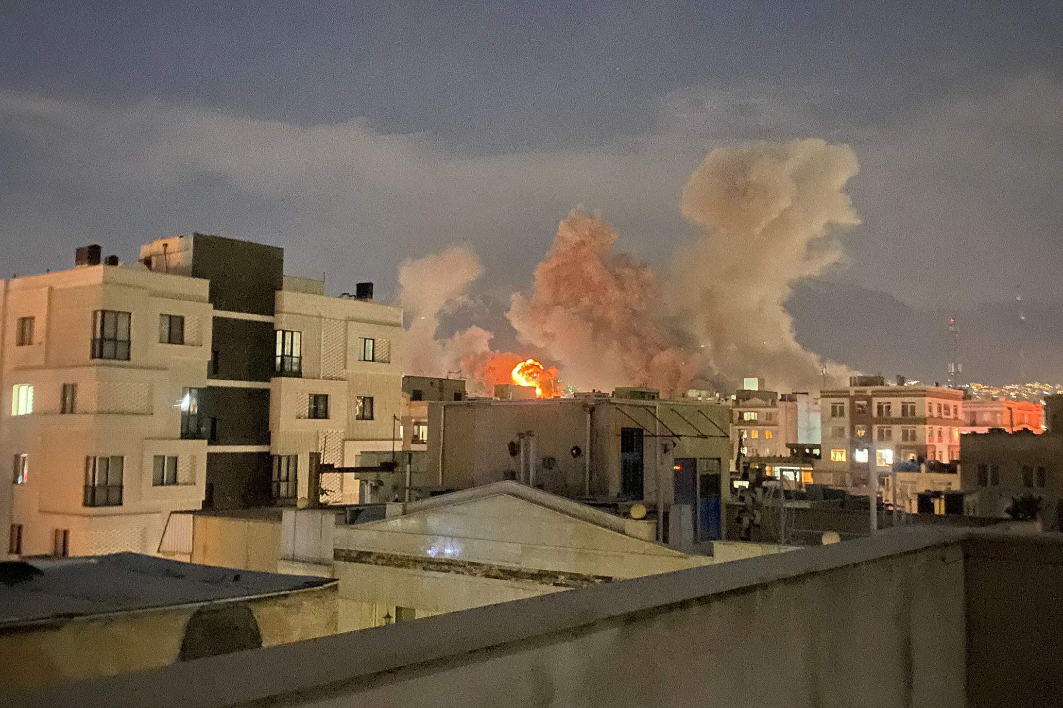 Plumes of smoke rise following reported explosions allegedly near Iran's Ministry of Intelligence on Araqi Street in Tehran on March 1, 2026