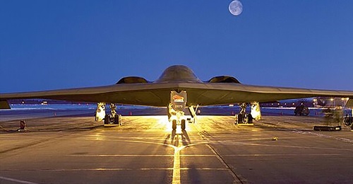 Seven B-2 Spirit bombers, flying east from the US