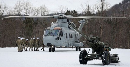 A Merlin Mk4 from Commando Helicopter Forces 845 Naval Air Squadron conducting training with a 105mm Light Gun from 29 Commando Regiment Royal Artillery during exercise 'Cold Response 2026' at Camp Viking in Norway in March.
