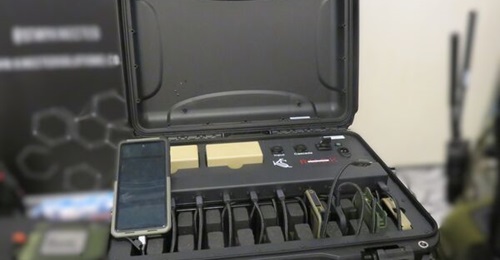 A Kinetic Solutions RUCK Ranger showing five different devices being recharged, with two batteries at the rear of the case providing power.