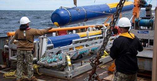 A Knifefish Unmanned Undersea Vehicle (UUV), a medium-class mine countermeasure UUV designed for deployment off the Littoral Combat Ship, being recovered during operational test.