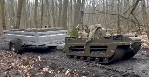 Image from a Russian MoD video posted on Telegram on 26 March showing a Kuryer UGV towing a trailer.