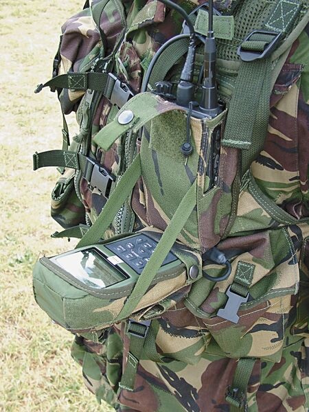 The DAGR-SA system on trial with the British Army comprises a Rockwell DAGR GPS terminal in a drop-down hands-free harness configuration, coupled to a Harris RF-300U SPR pocketset.