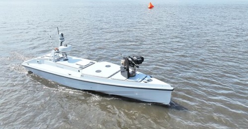 The Blue Ops Variant 7 USV equipped with the Allen Control Systems Bullfrog autonomous weapon station mounting an M240G machine gun forward during a demonstration on Lake Okeechobee in south Florida on 27 February 2026.