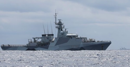 HMS 
        
        , seen here with a PLAN frigate on the horizon, while it is carrying out freedom of navigation operations in the South China Sea.