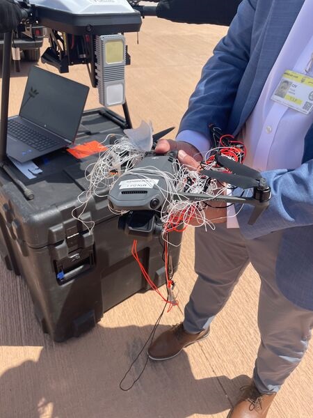A Lockheed Martin representative holds a DJI drone that was captured using its Sanctum software at Exercise 'African Lion 26".