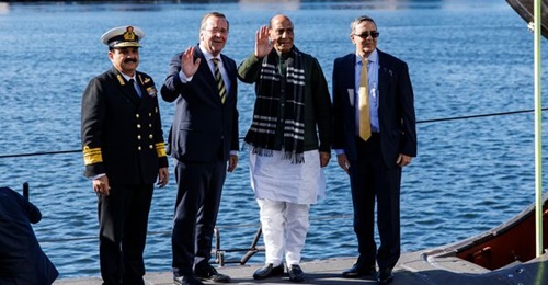 German Defence Minister Boris Pistorius (centre left) and his Indian counterpart Rajnath Singh (centre right) stand with officials at the TKMS submarine shipyard in Kiel, Germany, in April 2026.