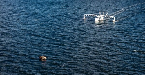 REGENT Craft's Seaglider prototype approaches downed personnel in a raft during a rescue demonstration for the US Marine Corps.