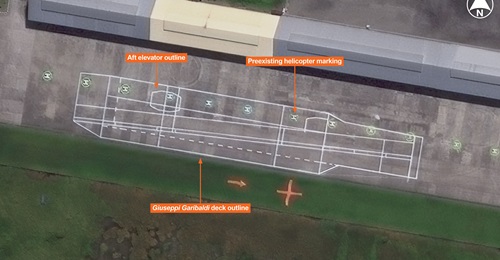 Vantor imagery shows a 1:1 scale deck outline of the former Italian Navy aircraft carrier Giuseppi Garibaldi at the Indonesian Navy's Juanda Surabaya Air Base. The deck outline is mirrored and is overlayed over preexisting helicopter markings.