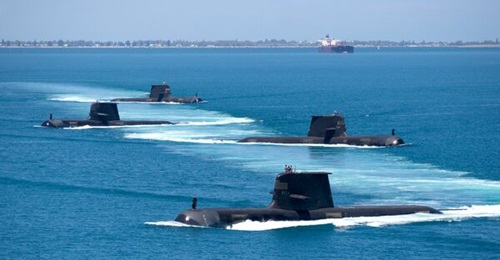 Collins-class submarines are pictured in formation while transiting through Cockburn Sound.