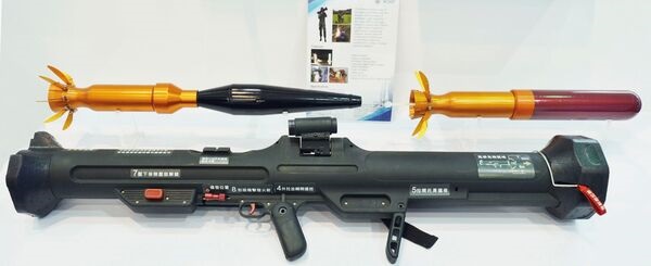 A first-generation Kestrel rocket launcher is shown with the HEAT (on the left) and HESH (on the right) munitions.