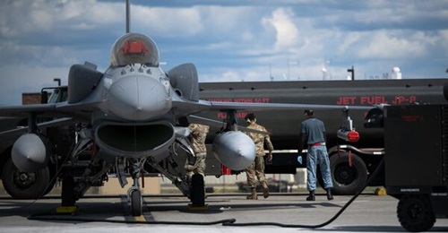 A Republic of Singapore Air Force F-16D equipped with an ELL-8212 ECM pod, fitted with a red protective cover, participates in Exercise 'Red Flag-Alaska' in June 2026.