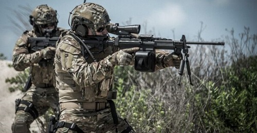Israel Defence Forces personnel are seen operating Negev LMGs fitted with Mepro X6 telescopic sights.
