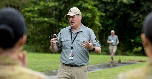 A DefendTex official demonstrates an unarmed Drone40 loitering munition to the Australian Army in 2021.