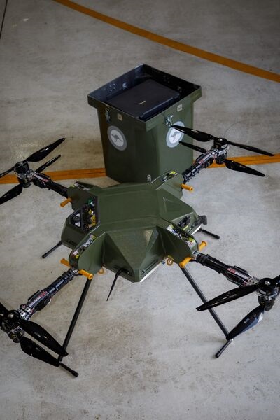 The Air Launched Delivery Drone (Aladdin) at RAAF Base Edinburgh in June 2026. The UAV's cargo container can be seen in the background.