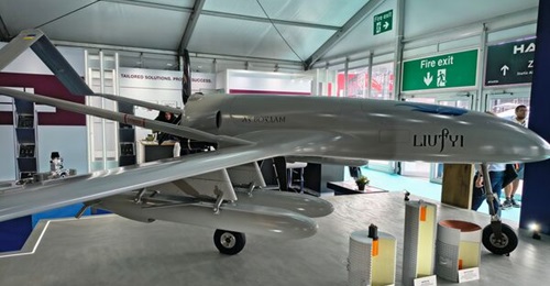 Ukrainian Defence Industry's (Ukroboronprom's) Liutyi fixed-wing UAV equipped with four missiles, unveiled at Farnborough 2026.