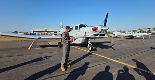Lieutenant Heydan 'Eskimo' Chan of the Papua New Guinea Defence Force (PNGDF) Air Transport Wing stands beside a PAC P-750XL aircraft deployed to Australia's Exercise 'Pitch Black' 2026.