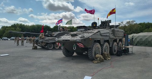 A British Army Boxer armoured vehicle in a command configuration integrated with a Starlink terminal, seen at Exercise Mercury Acumen on Salisbury Plain, Wiltshire in July 2026.
