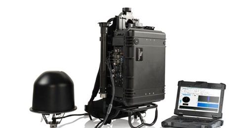 Image of Rohde & Schwarz R&S MP007 man-portable DF system which includes an R&S ADD507 compact VHF/UHF DF antenna, R&S PR200 portable monitoring receiver inside a transport case, and laptop.