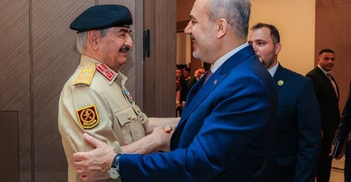 LAAF leader Khalifa Haftar (left) greets Turkish foreign minister Hakan Fidan in Benghazi on 12 August.