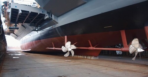 Aircraft carrier John F Kennedy, shown here under construction, completed sea acceptance trials.