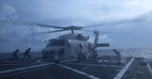 A JMSDF SH-60K helicopter landing on the flight deck of RSS 
        
         during Exercise 'Singapan'.