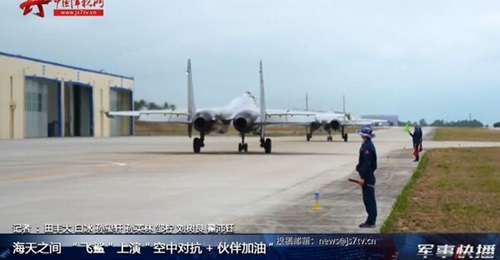 A screengrab from footage released by CCTV on 27 May showing two PLANAF J-15 multirole fighters about to take off from Lingshui Airbase on Hainan Island in the South China Sea.