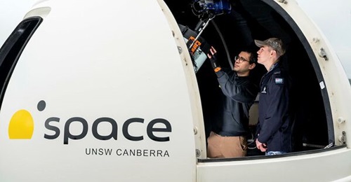 Tarik Errabih, UNSW Space Surveillance Operations Manager, and Flying Officer Jack Jones from the ADF's Space and Cyber Capability Division inspect the UNSW Viper optical telescope.
