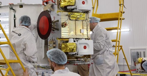 Image of workers from Bureau 1440 preparing satellites from Rassvet-2 for launch.