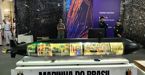 The Brazilian state-owned company NUCLEP has recently completed and delivered the qualification section that will be used to later build the country's first nuclear-powered submarine, a model of which is shown here.