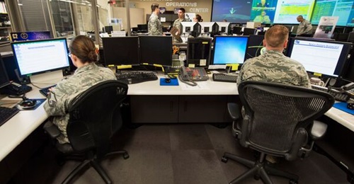 Airmen of the Joint Space Operations Center (JSpOC) monitor computer systems designed to detect, track, and identify all artificial objects in Earth's orbit at Vandenberg AFB, Calif, Sept. 27, 2014.