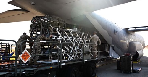 Airmen and Riggers with the 1st Special Operations Squadron Logistics Readiness Squadron load a Rapid Dragon Palletized Weapon System aboard an MC-130J Commando II at Hurlburt Field, Florida, on 13 December, 2021.