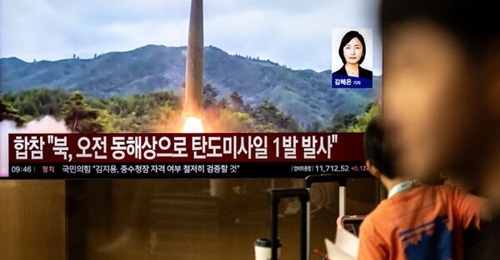 A South Korean television broadcast shows footage of North Korea's reported 3 October intermediate-range hypersonic missile launch drill.