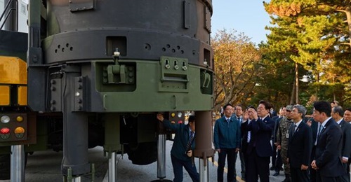 South Korean President Lee Jae Myung and government and defence officials pose with the Hyunmoo-5 high-power ballistic missile system after observing the country's first HGV test launch on 8 October 2026. (Office of the President of the Republic of Korea)