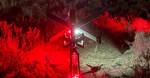 Helsing's HX-2 loitering munition ready for launch at night.