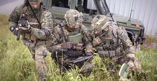 German soldiers share digital situation images on mobile devices as part of the D-LBO rollout.