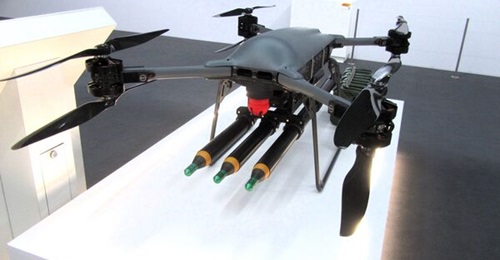 A Malloy TRV-150 heavy-lift UAV carrying three APKWS laser-guided rockets at the Farnborough International Airshow 2026.