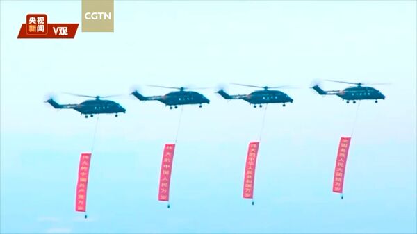 A screengrab from CGTN footage from 1 July showing four units of the recently inducted Z-8L transport helicopter flying in formation over Beijing to mark the 100th founding anniversary of the CPC. (CGTN)
