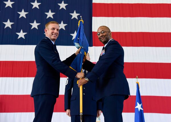 US Air Force Colonel William Young accepts command of the 350th Spectrum Warfare Wing from US Air Force Warfare Center Commander Major General Case Cunningham. (US Air Force)