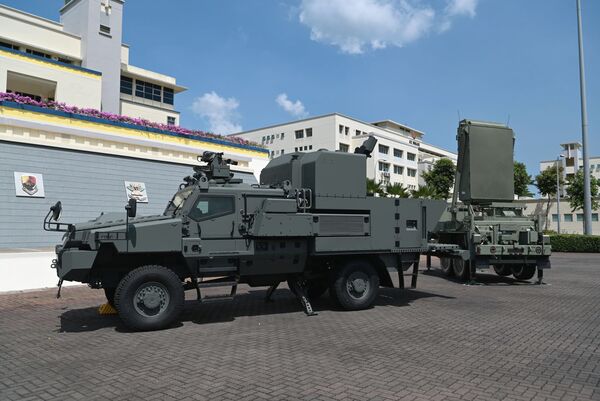 The Singapore Army commissioned a mortar-equipped variant of the Belrex Protected Combat Support Vehicle and TPQ-53 Weapon Locating Radar on 28 June. (MINDEF)