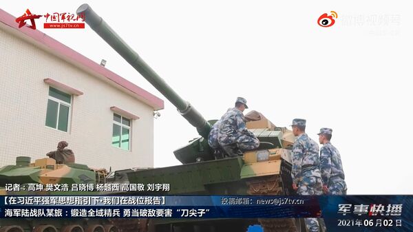A screengrab from footage released by CCTV on 2 June showing PLANMC personnel inspecting ZTQ-15 light tanks. (CCTV)