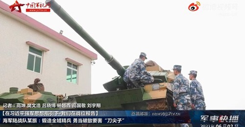 A screengrab from footage released by CCTV on 2 June showing PLANMC personnel inspecting ZTQ-15 light tanks.