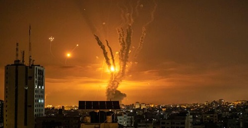 Rockets launched towards Israel from the northern Gaza Strip are targeted by Israel's Iron Dome missile defence system on 14 May 2021. The USMC is moving forward with a new initiative that will repackage the Tamir launcher on a trailer.