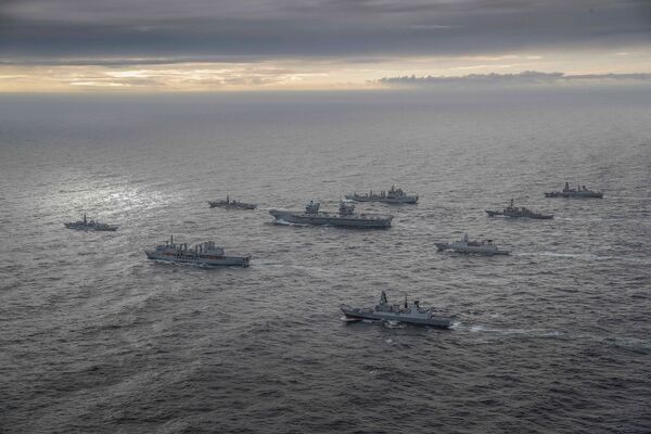 
        In his 27 July speech about ‘integrated deterrence' Austin pointed to the deployment of Royal Navy aircraft carrier HMS 
        Queen Elizabeth
         to the Asia-Pacific region as the flagship of a multi-nation carrier strike group (seen here) that includes a US destroyer and a US Marine Corps F-35 squadron.  
       (Crown Copyright)