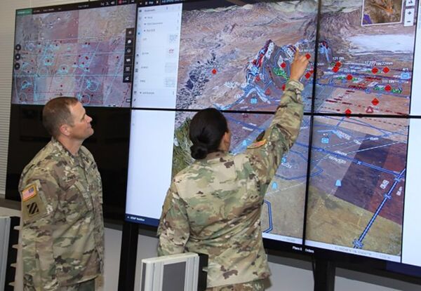 US soldiers observe a demonstration of the Command Post Computing Environment Tactical Service Infrastructure at Aberdeen Proving Ground in Maryland. (US Army )