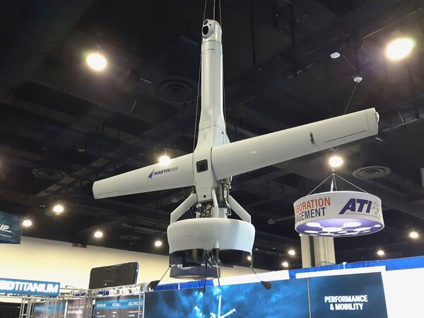 
        The Martin UAV V-Bat 128 vertical take-off and landing (VTOL) tail-sitting fixed-wing unmanned aerial vehicle (UAV) on display at Navy League's 2021 Sea-Air-Space exposition on 3 August 2021. The USMC awarded Martin UAV a contract to develop an electric engine for an aircraft similar to the V-Bat, 
        Janes 
        has learned.
       (Janes/Pat Host)