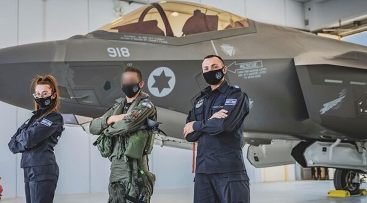 IAF personnel pose in front of one of six F-35I Adir aircraft that have been deployed to Italy for the service's first overseas exercise using the type.